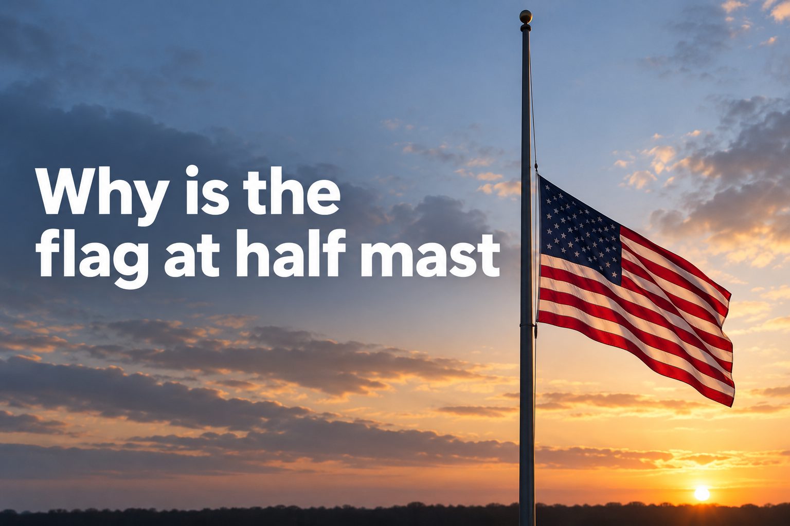 American flag flying at half-mast against a clear sky